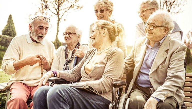 image of an elderly group of people outside talking.