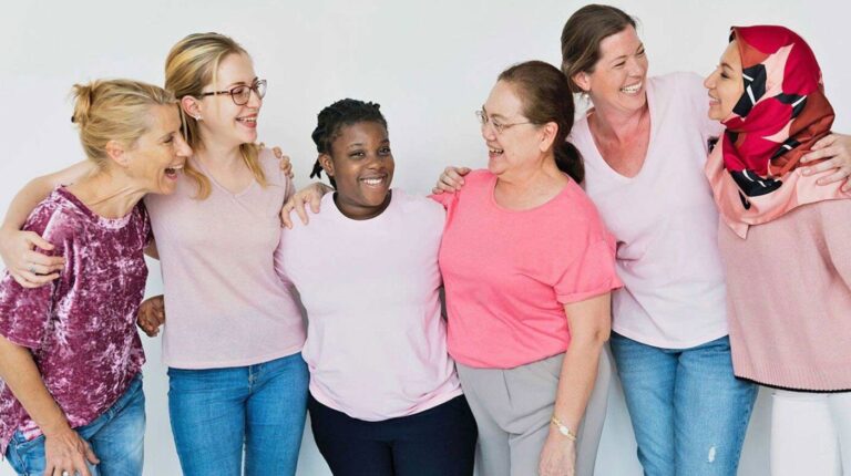 Image of a diverse group of women smiling.