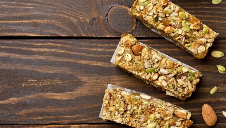 Image of granola bars on wooden table.