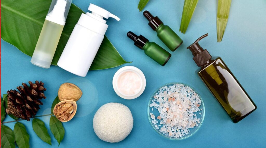 Image of various personal care products on blue table.