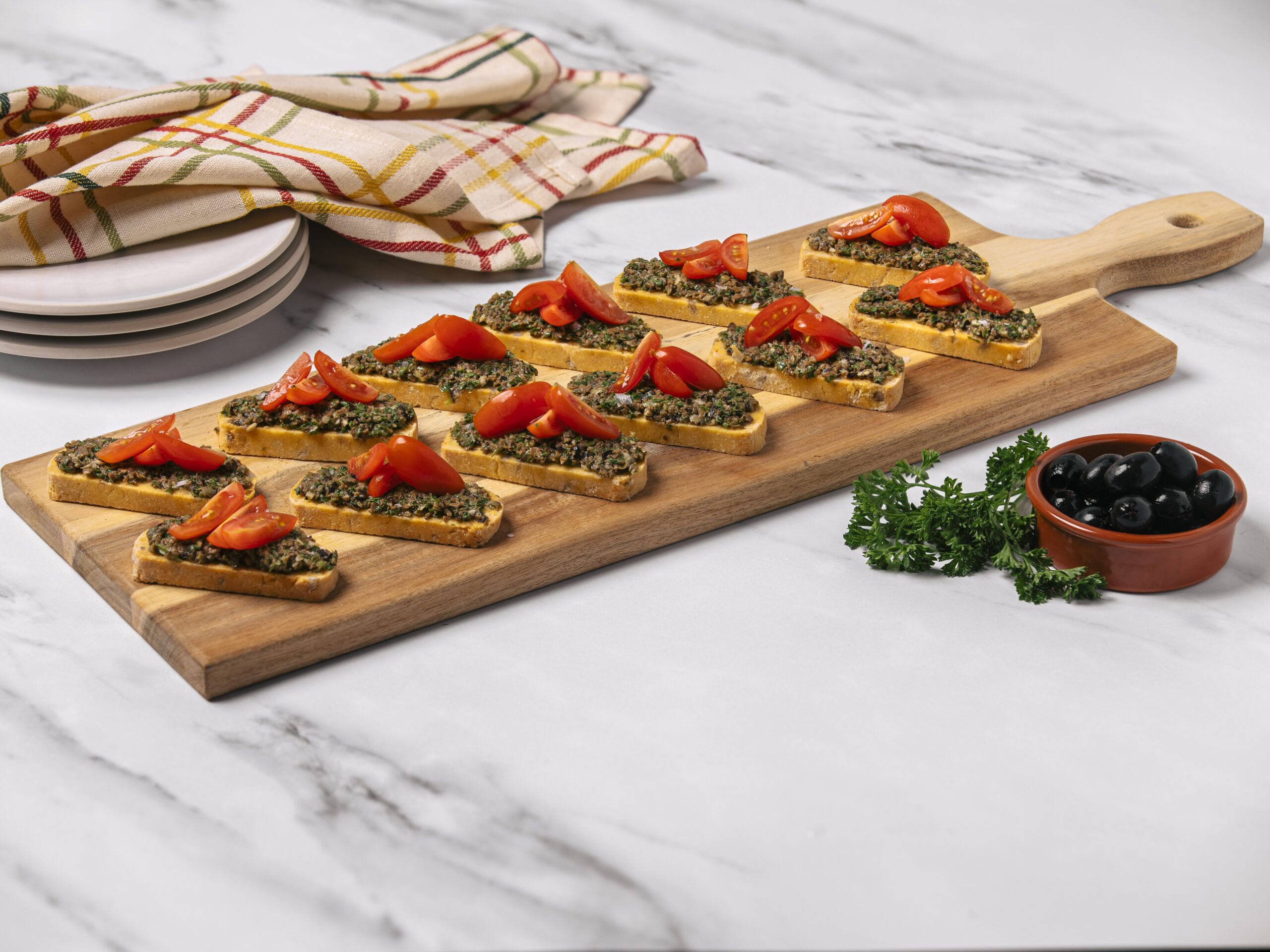 Savory Sunflower Seed Biscotti with Black Olive Tapenade Bruschetta