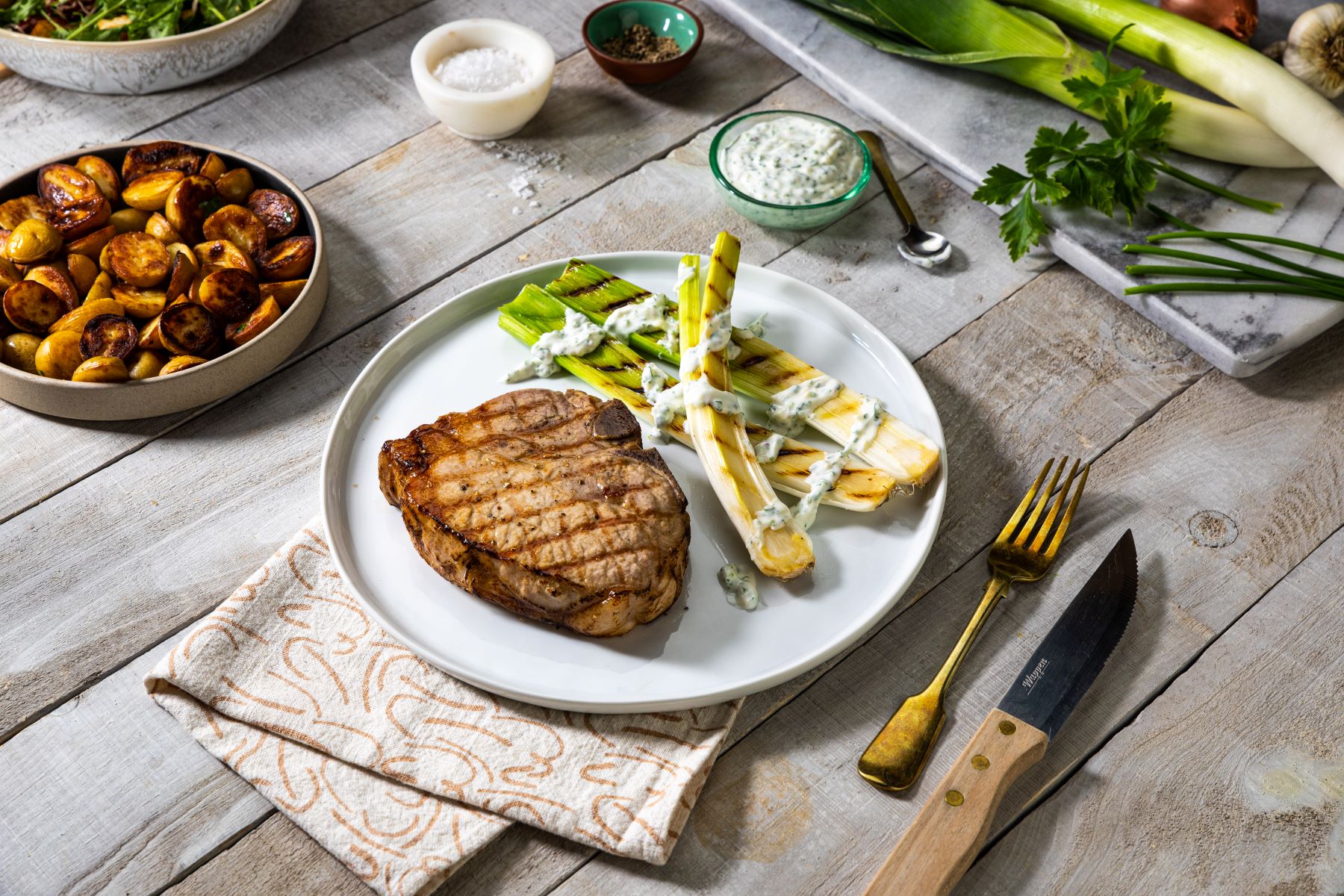Grilled Pork Chop with Grilled Leaks - Calgary Co-op